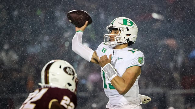 Buford's Dylan Raiola passes over the pass rush of Mill Creek's KingJoseph Edwards. 11/13/2023